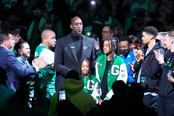 Basketball Hall of Fame and former Boston Celtic and Kevin Garnett is introduced and walks out onto the court with his daughter during his number retirement ceremony after game between the Boston Celtics and the Dallas Mavericks at TD Garden.